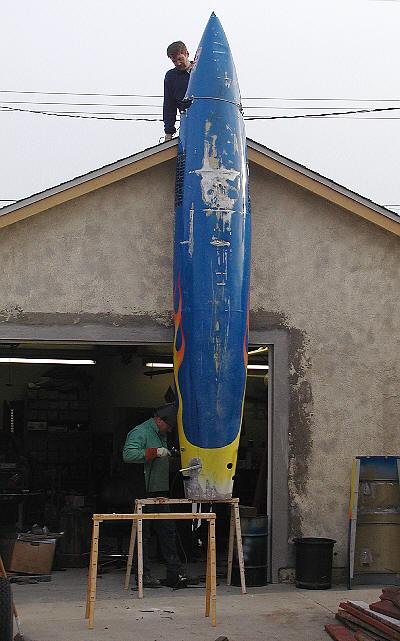 Welding with the body up in the air.